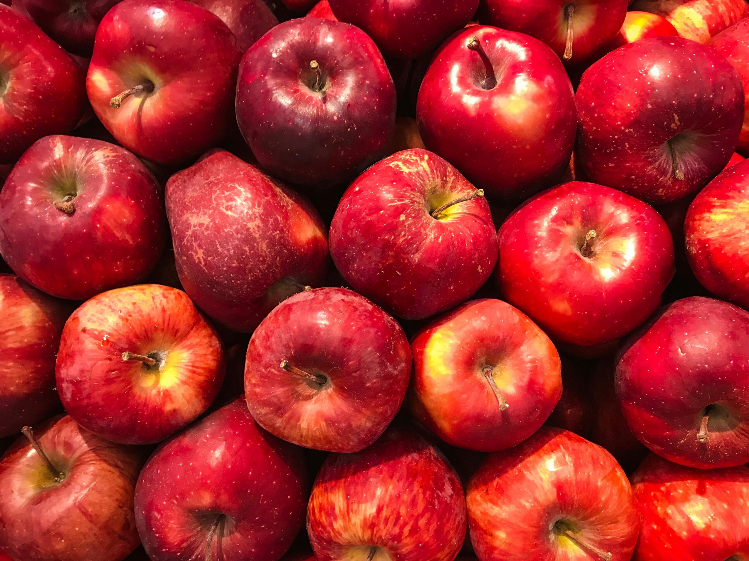 A vibrant collection of fresh red apples showcasing healthy abundance.